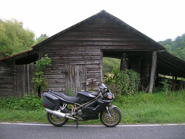 [The Geezer Glide in front of an old barn in northern Pickens County.]