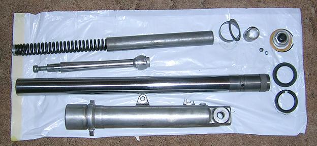 [The left fork assembly disassembled for repair.]
