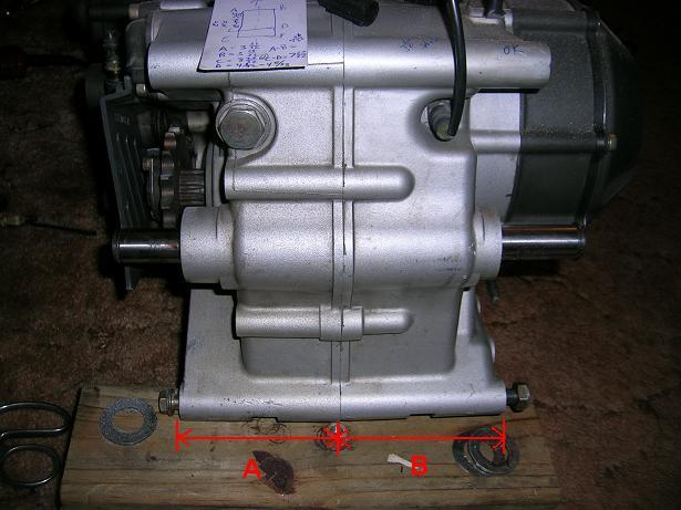 [The shrouded section of the lower engine mount that is hitting the frame.]