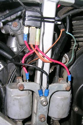 [Relay added to reduce voltage drop to the ignition coils.]